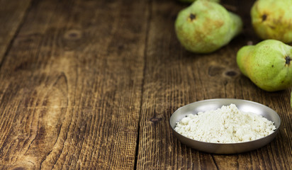 Portion of healthy Pear powder (selective focus; close-up shot)
