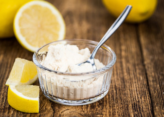 Portion of fresh Lemon powder (selective focus; close-up shot)