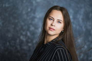Naklejka premium portrait of a young long-haired brunettes