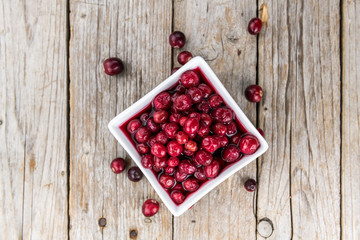 Some fresh Cranberries (preserved) (selective focus; close-up shot)