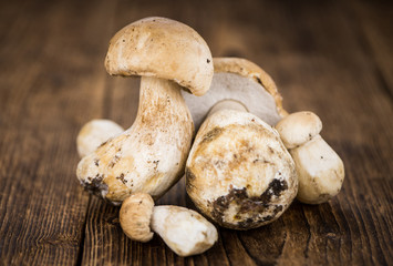 Fresh Porcinis on an old wooden table (close-up shot)