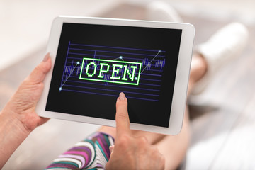 Open stock market concept on a tablet