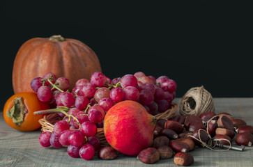 Autumnal fruits. Background: total black.