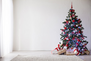 Christmas tree with red decorations new year gifts