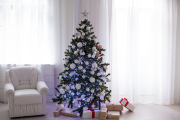 White room decorated for Christmas new year tree gifts