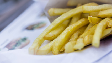 French fries lying on the table, selective focus