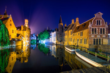 Brugge with the Perez de Malvenda house and Belfort van Brugge in the background at night, Belgium.