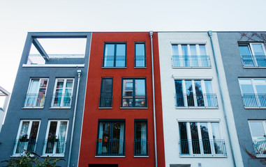 Obraz premium cold colored townhouses in a row