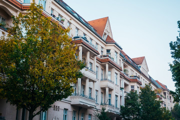 rose colored buildings in a street at treptower park