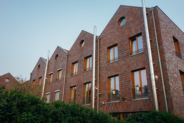 Fototapeta na wymiar modern brick renovated townhouses in industrial style