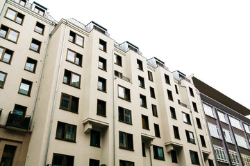 white apartment complex with square formed facade