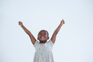 Portrait of smiling little girl dressed as businesswoman