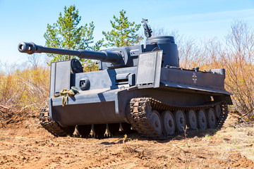 Fototapeta premium Reconstructed vintage German Tiger tank on the battle field in summer sunny day