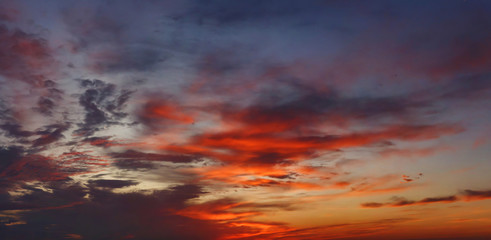 Obraz premium Colorful cloudy sky on sunset. Color blue red sky background