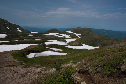 Panoramic view on green slopes around Mount Kurodake, Daisetsuzan National Park, Hokkaido, Japan