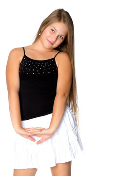 A teenage girl in a short white skirt and a black T-shirt.