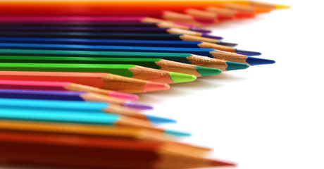 Multicolor bright color pencils vertical wave on white background