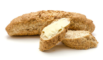Wheat bran bread snack with butter and salt isolated on white background one whole and two pieces