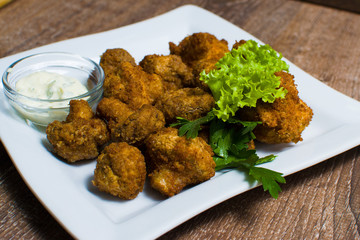 fried champignons with sauce