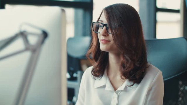 Close up woman wearing glasses uses a computer typing on a keyboard in office screen tablet coworking girl technology business female internet attractive standing startup worker Slow Motion Shot