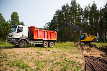 loading of nonmetallic materials by an excavator
