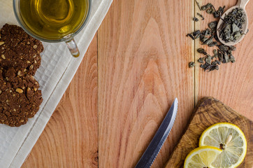 Green tea on a brown board. Top view.