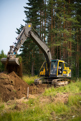loader excavator machine doing earthmoving work 