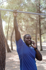 Black man using mobile while have a training