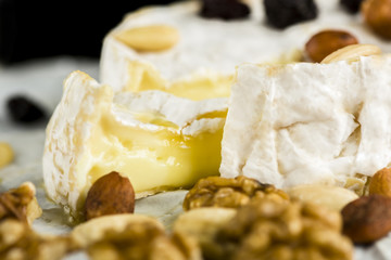 Camembert cheese with nuts, fruit and honey