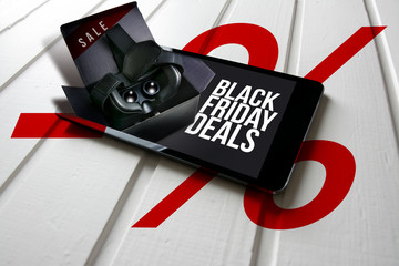 Black friday deals, promotion on computer tablet screen, box with virtual reality glasses come out of the tablet screen.