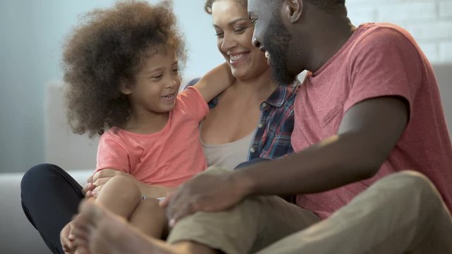 Close-up of cheerful family enjoying time together and having fun at home