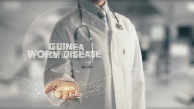 Doctor holding in hand Guinea Worm Disease