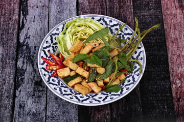 Spicy sour mixed herb salad with fried tofu.
