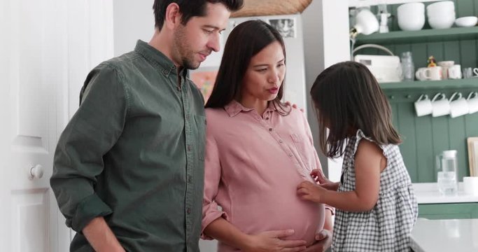 Pregnant mother with daughter and family