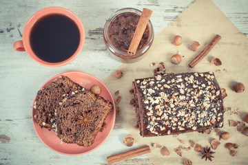 Vintage photo, Black coffee, dark cake for Christmas time with chocolate, cocoa and plum jam