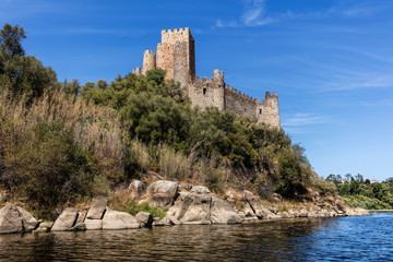 Fototapeta na wymiar Castle of Almourol in Portugal, initiated the 12th century, located on a small islet in the middle of the Tagus River, served as a stronghold used during the Portuguese Reconquista.