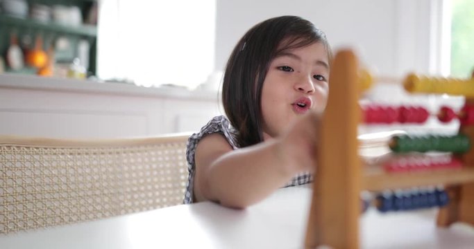 Girl using abacus to count