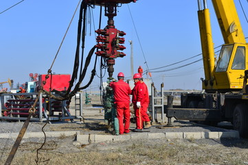 field oil workers at work