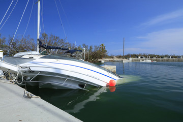 Boat overturned and underwater at Boca Chica Marina after Hurricane Irma