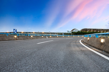 Asphalt road and city buildings at the airport