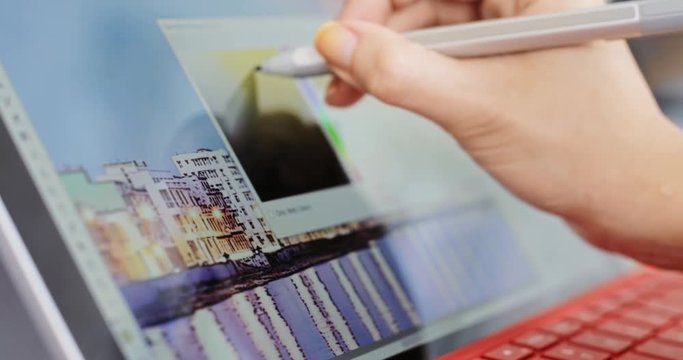 Photographer Using Computer Software For Photography Editing In Office