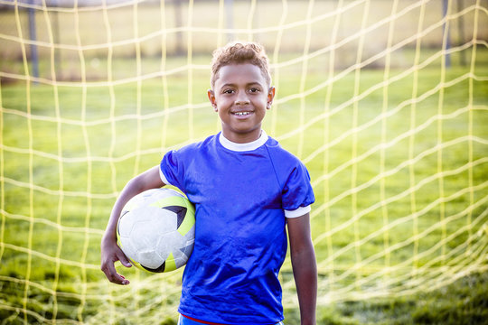 Diverse young boy on a youth soccer team 