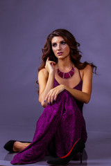 Obraz premium beautiful girl with long hair in purple dress