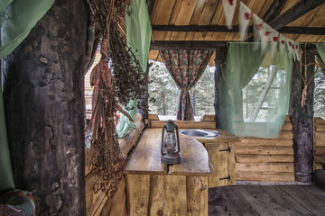 Rural kitchen in wooden gazebo