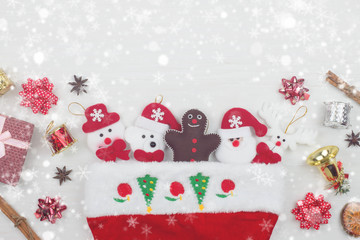 Christmas and Happy new year object decoration flat lay with copy space on white wooden table background with snowfall.Gifts and congratulations concept.