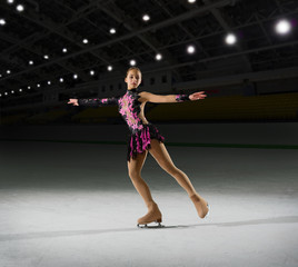 Woman figure skater at sports hall