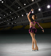 Woman figure skater at sports hall