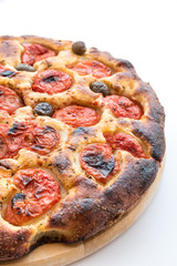 Focaccia typical of Bari Italy with tomatoes and olive
