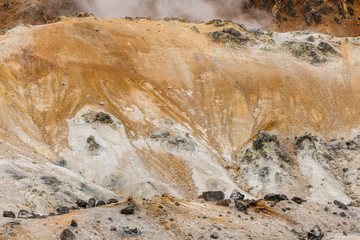 Close up detail of Noboribetsu Jigokudani (Hell Valley): The volcano valley got its name from the sulfuric smell, extremely high heat and steam spouting out of the ground in Hokkaido, Japan.