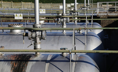 metal tanks for gas storage inside an industrial area